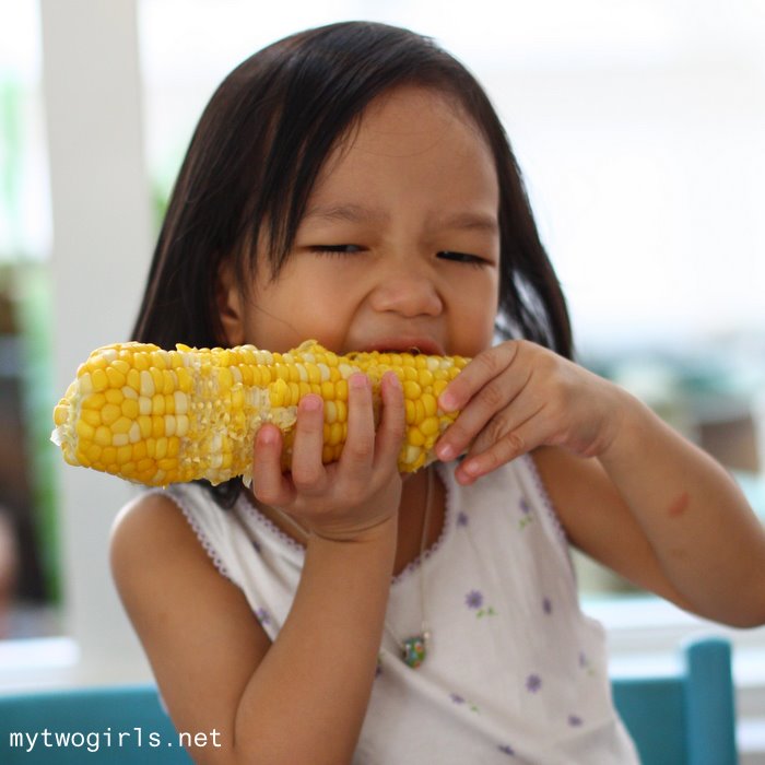 Zaria munching on a corn